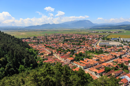 View of the city of Rasnov from a high point in the mountains of Transylvania. Romania