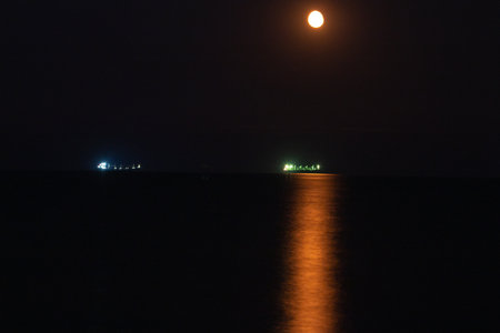 The moon on the sea at night in Odesa. Ukraineの写真素材