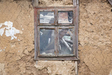 Empty window in abandoned ruined houseの写真素材