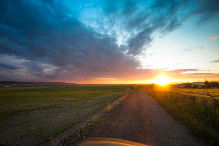 This road and beautiful sunset are calling you for new adventures!