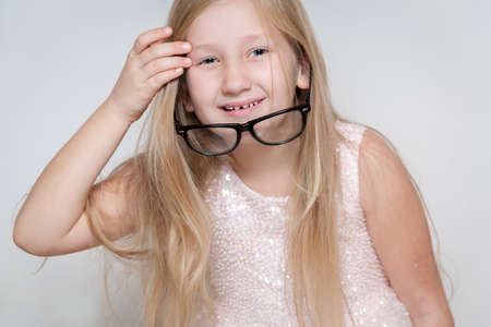 Little girl has fun while making facesの写真素材