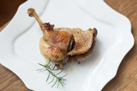 Cooked roast turkey chicken isolated on white plate - depends on what you are looking forの写真素材