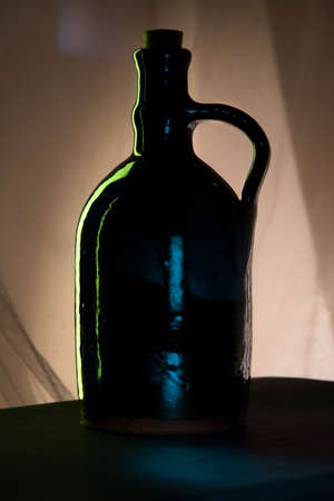 Silouette of bottle for wine or water in shadow.の写真素材