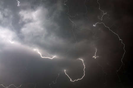 Huge massive curtain of lightning in the nightの写真素材