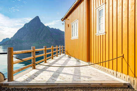Yellow rorbu in small island Sakrisoy in Lofoten islands, Norway