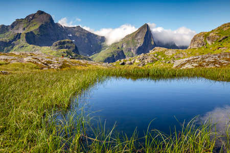 Beautiful lake near the Munkebu hut in Lofoten Islands, Norwayの写真素材
