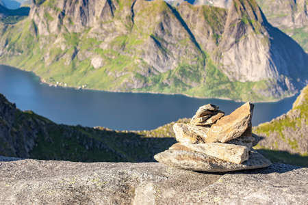 Rock cairn mark the route to Munkan mountain in Lofoten islands, Norwayの写真素材