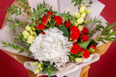 The girl with big bouquet of colorful flowersの写真素材