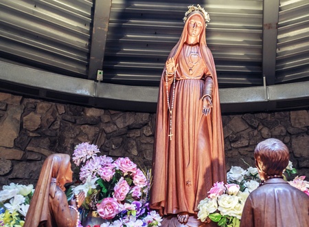 Statue recreating the miracle at Fatima  Mother Mary visits young children  の写真素材