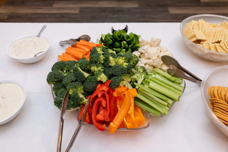 Varieties of chopped vegetables arranged in plate on table