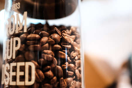 roasted coffee beans in the bottleの写真素材