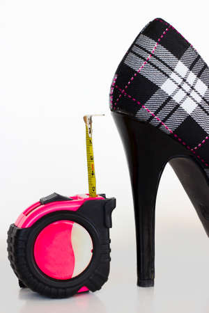A plaid high heel is being measured.の写真素材