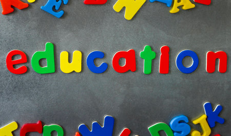 Colorful magnetic letters spell out the word education.の写真素材