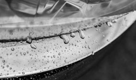 Rain drops on a chrome surface.の写真素材