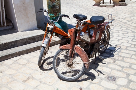 Two old fashioned moped in Djerba - Tunisia -の写真素材