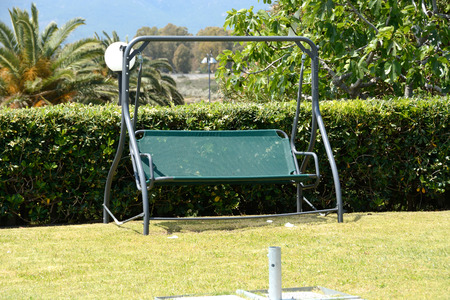 garden swing chair.Quiet relaxing day in the back gardenの写真素材