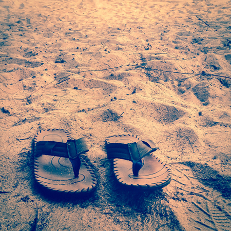 slippers on the beachの写真素材