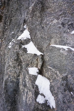 The texture of rock in Tianmen Mountain cliff, there is some snow fill in the groove ,Zhangjiajie,Chinaの写真素材