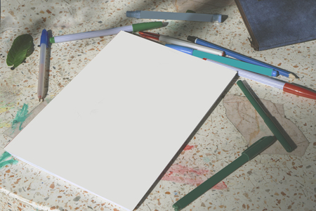 Blank paper on stone table with color pens for business,education conceptの写真素材