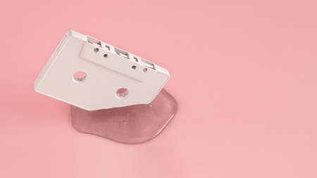 White cassette tape melt on pink background. Minimal retro music concept.