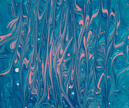 Creative metalic blue and baby pink background and white dots made of paint and nail polish.の写真素材