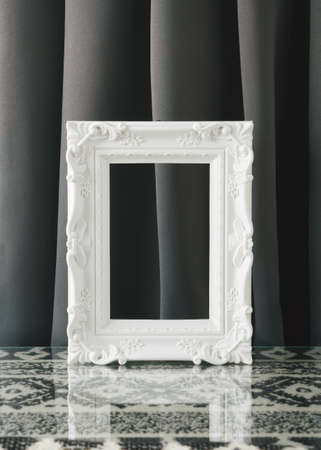 Creative monochrome arrangement made of retro picture frames on a gray background. Minimal vintage concept.の写真素材
