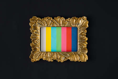 Creative arrangement made of gold frame and color for no signal on a dark background. Minimal flat lay concept.の写真素材