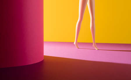 Creative step arrangement made of women's legs on a yellow and pink background. Minimal shadow and light concept. Beauty and walking inspiration.の写真素材