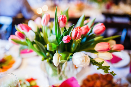 a bouquet of tulips in the kitchen on the tableの写真素材