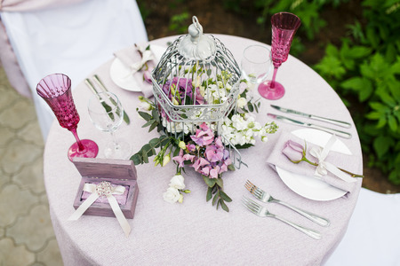 Wedding decor. Flower in a decorative cage.の写真素材