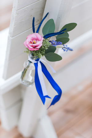 Flowers bouquet in vase on the table. Wedding decoration, decor. Holiday decoration flowers.の写真素材
