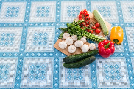 Fresh ripe vegetables on table in a summer gardenの写真素材