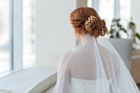 Gold or red hair of the bride. Wedding hairstyles closeup.の写真素材