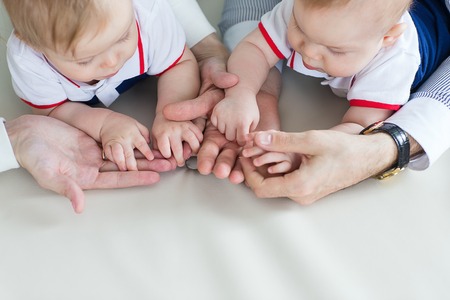 Family holding hands together closeup. Happy familyの写真素材
