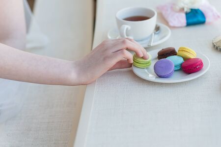 luxary wedding rings with macaroons near windowの写真素材