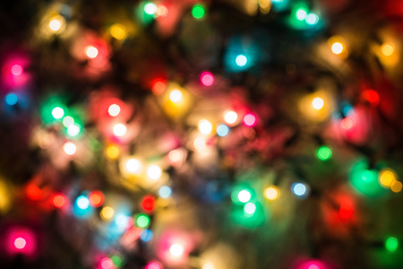 Multicolored defocused bokeh blurry lights, Christmas lights, festive backgroundの写真素材