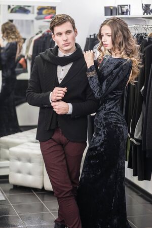 young and fashionable couple shopping clothesの写真素材