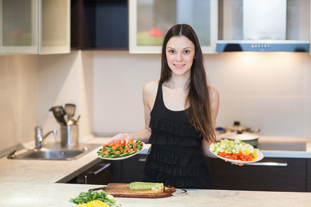 Young Woman Cooking in the kitchen.