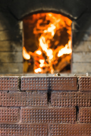 form for inscription on background Russian stove and burning it birch firewoodの写真素材