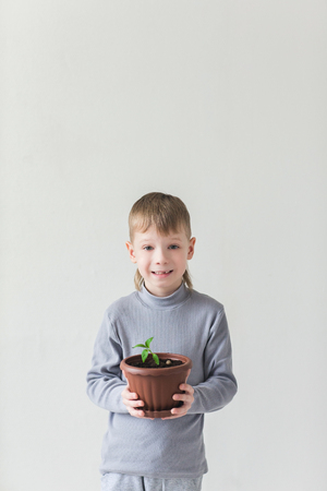 Baby boy and the symbol of Earth Day and ecologyの写真素材