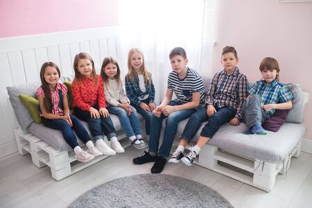 group of happy schoolmates girls and boys friends