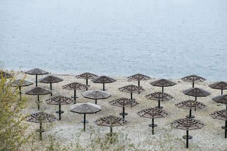 Umbrellas awnings on the winter beachの写真素材