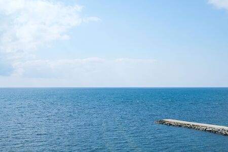 Evening pebble transparent sea.の写真素材