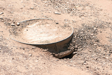 Sewer cover on the road in the city.の写真素材