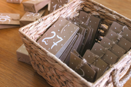 Christmas advent calendar in a wicker basket.