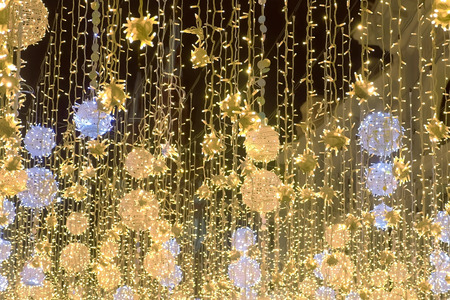 Golden christmas lights beautiful twinkle decorations of street.