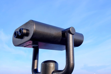 Large binoculars on the observation deck against the blue sky.の写真素材