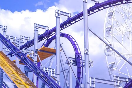 Installation of roller coaster ride in amusement Park on blue sky background at Sunny day.の写真素材