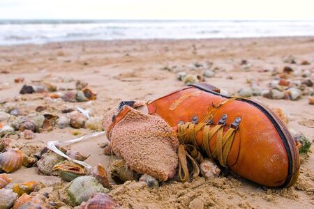 Environmental pollution by shoes and household waste.の写真素材