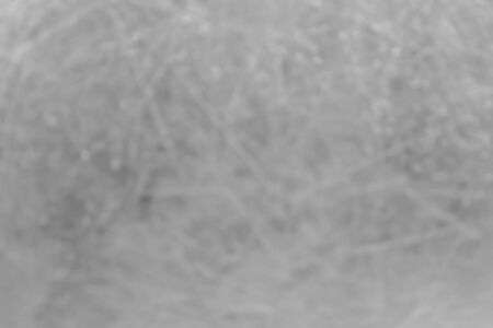 Silver shiny scratched background with water drops. Blur.の写真素材